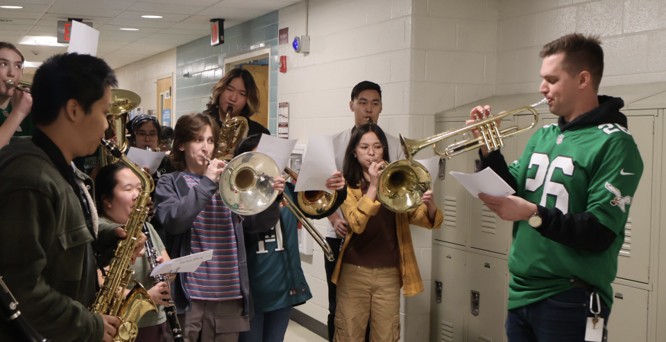 Fly Eagles Fly: Music teacher Christopher Nation and Wind Ensemble perform the Eagles’ fight song on Feb. 7. They performed around the school during eighth period.  